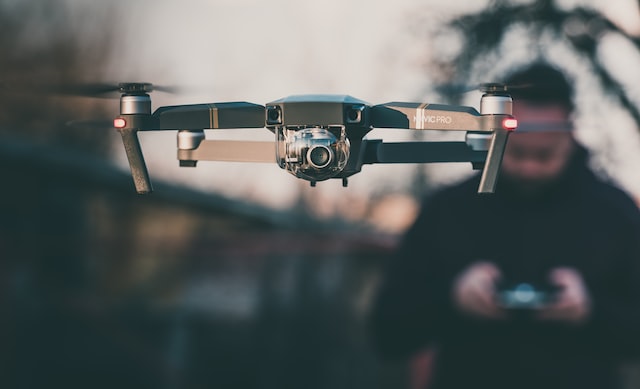 a man controls a drone